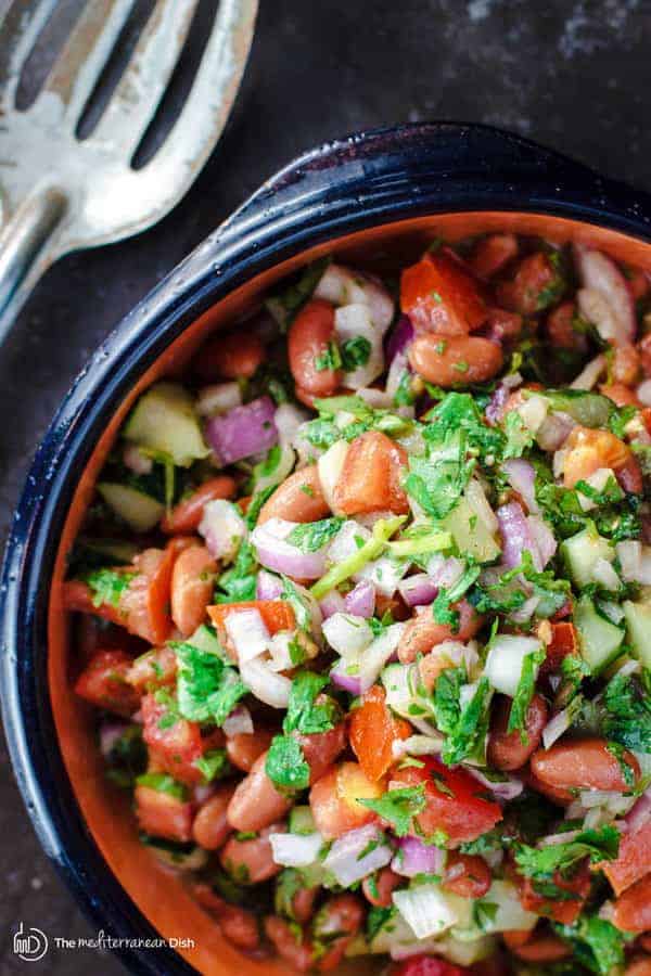 Kidney Bean Salad with Cilantro and Dijon Vinaigrette | The Mediterranean Dish. BuzzFeed calls this salad, “incredible!” A simple and tasty salad of kidney beans, chopped cucumbers, tomatoes and red onions with cilantro, sumac and a zesty Dijon vinaigrette. It will be your new favorite!