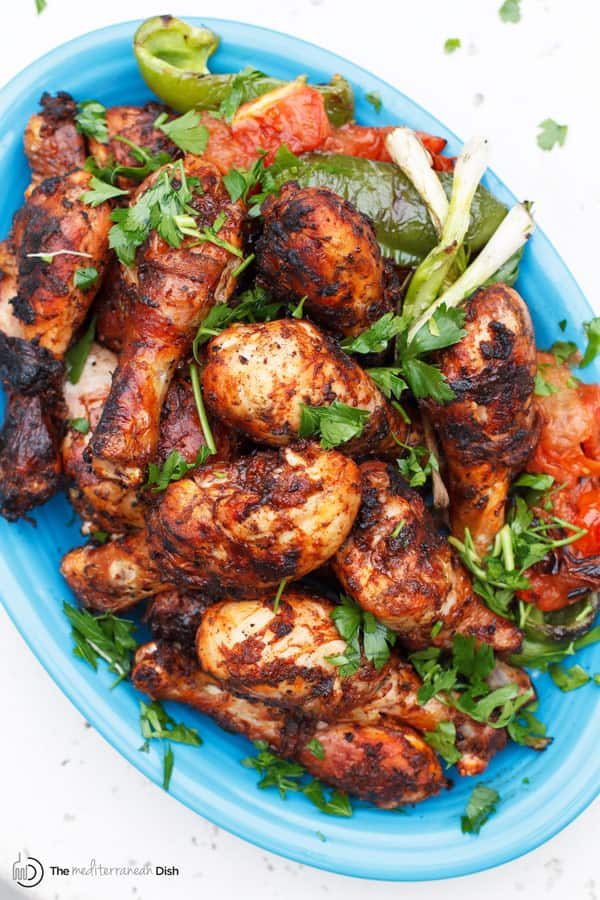 Grilled Chicken Drumsticks with rich red color from Harissa marinade