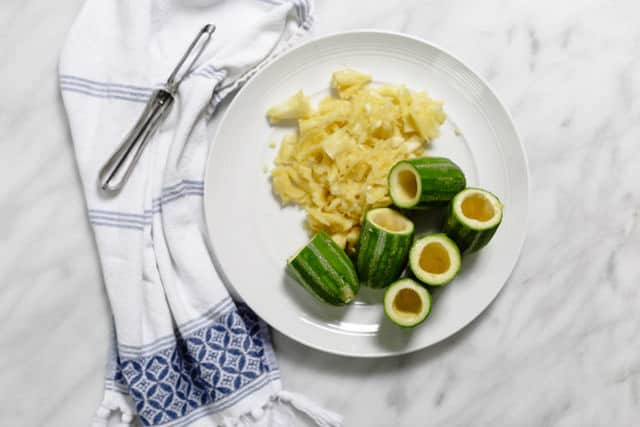 Zucchini centers carved out to allow for stuffing to be added