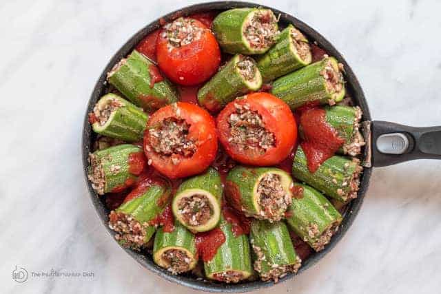 Stuffed Zucchini and tomatoes in a skillet 