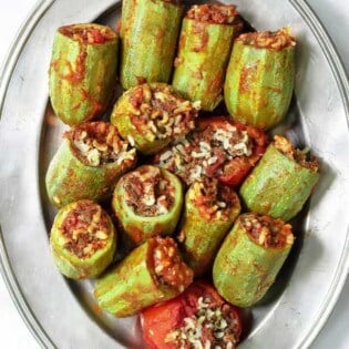Middle Eastern Stuffed Zucchini | The Mediterranean Dish. See my step-by-step tutorial for foolproof results! Here zucchini are cored and stuffed with a special filling of spiced rice and beef with tomatoes and fresh herbs. Delicious! TheMediterraneanDish.com