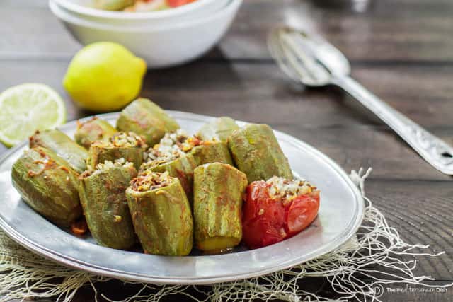 Meat, rice and tomato-stuffed zucchini plated to be served