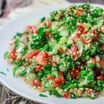 Tabouli Recipe (Tabouleh) | The Mediterranean Dish. Authentic Middle Eastern tabouli salad with fresh parsley, mint, bulgur, finely chopped vegetables and a simple citrus dressing. See the step-by-step tutorial at The Mediterranean Dish food blog.