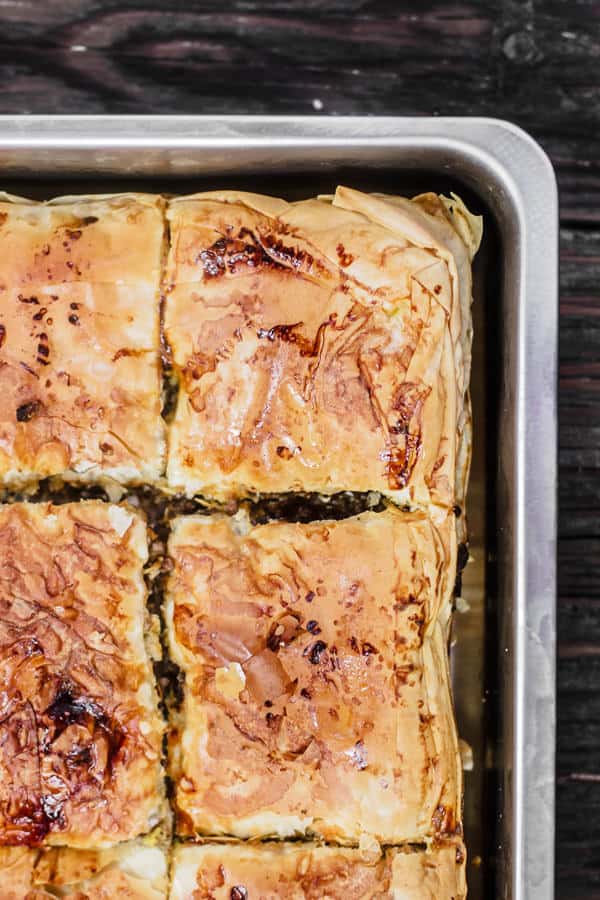 Phyllo Meat Pie Recipe (Egyptian Goullash) | The Mediterranean Dish. Spiced ground beef nestled in between layers of crispy, flaky, buttery phyllo dough! Recipe comes with step-by-step photos. An easy dinner with a big wow factor!