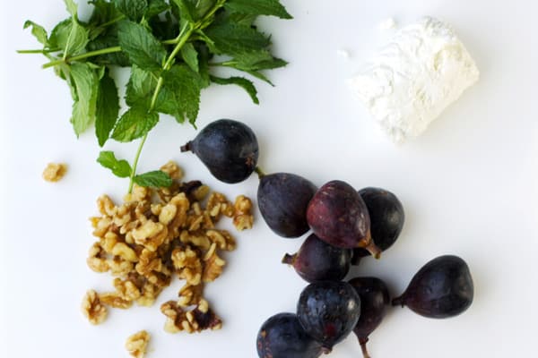 Figs, mint, goat cheese and walnuts on the table