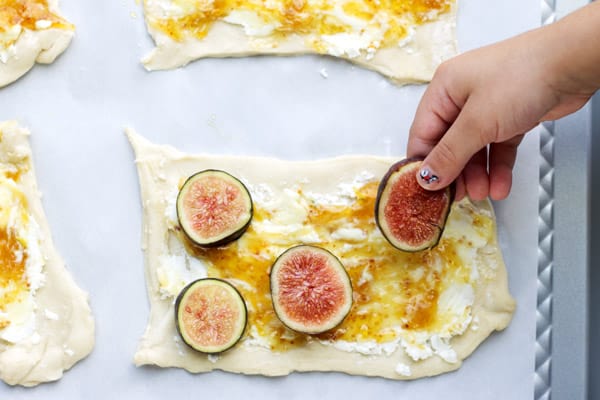 Figs placed on puff pastry containing goat cheese and jam