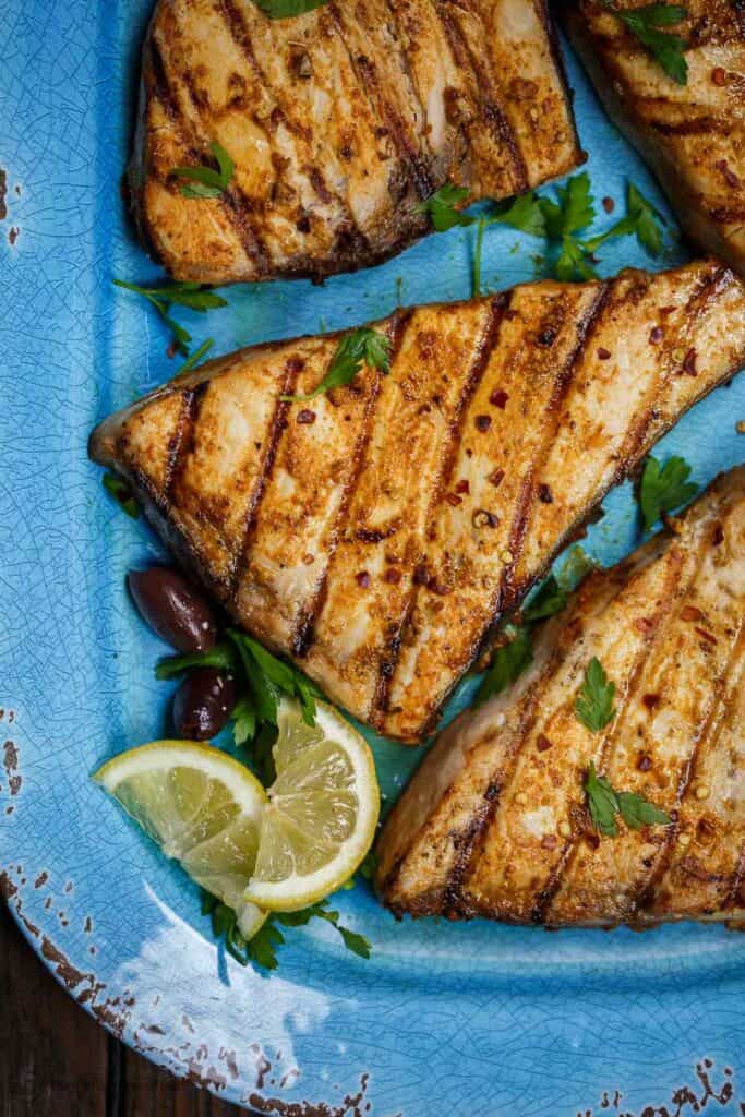 grilled sword fish with a side of limes