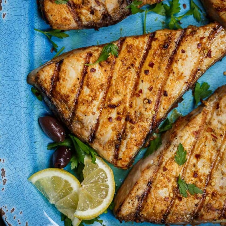grilled sword fish with a side of limes
