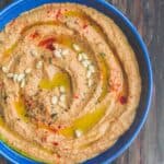 Roasted red pepper hummus with olive oil and pine nuts