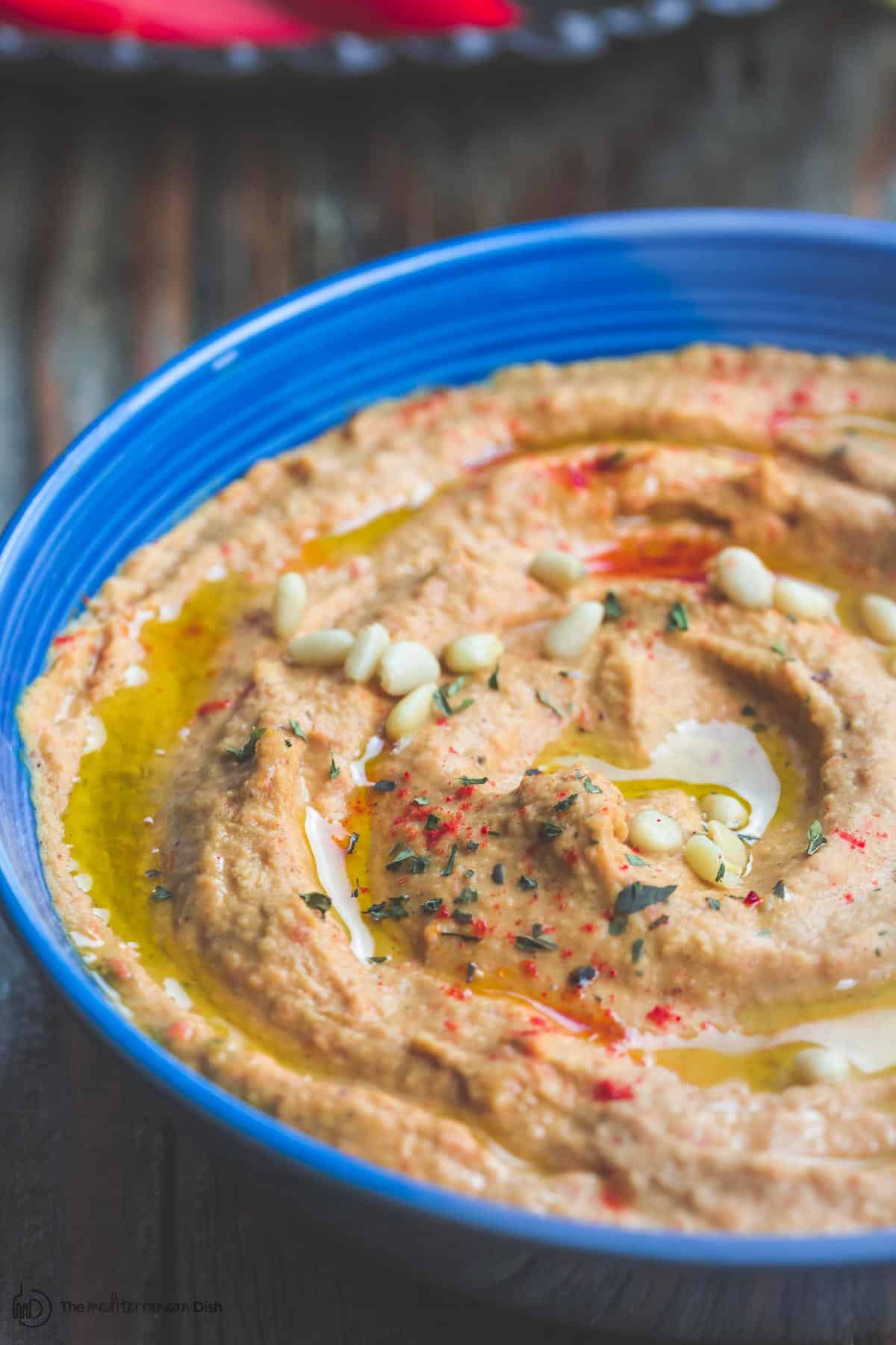 Roasted Red Pepper Hummus in a serving bowl ready to be served
