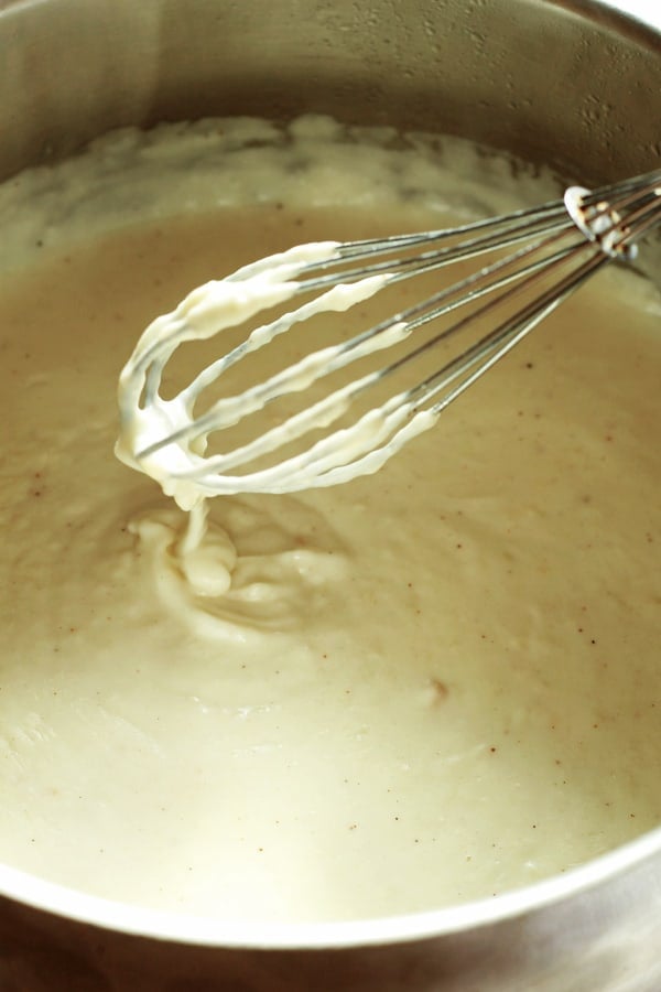 Ingredients for the bechamel sauce being whisked together