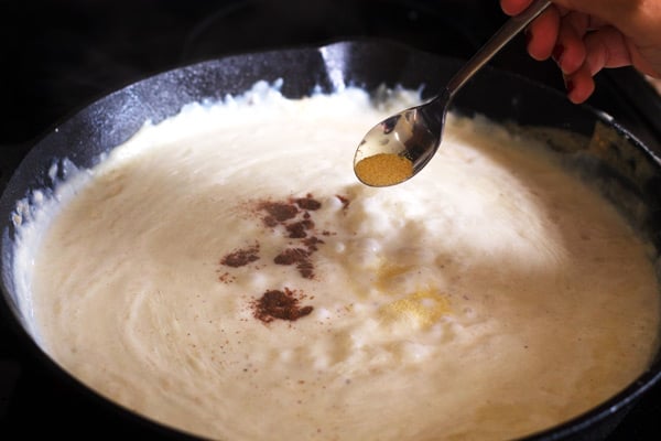 Nutmeg, garlic powder and salt added to skillet