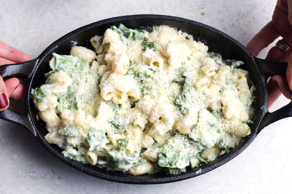 Extra Parmesan cheese added to top of spinach mixture and added to a baking dish