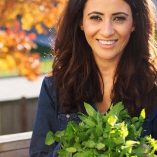 Suzy Karadsheh from The Mediterranean Dish with freshly picked spearmint