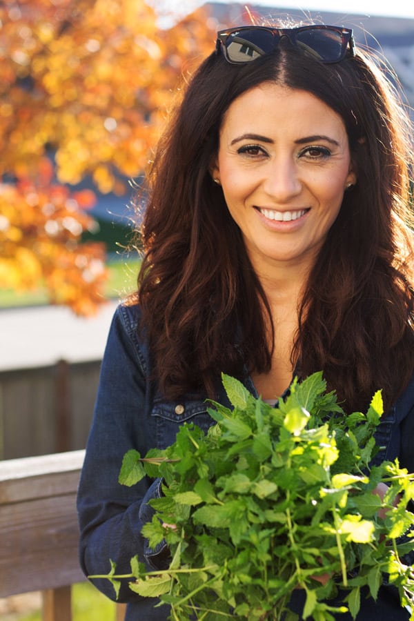 Suzy Karadsheh from The Mediterranean Dish with freshly picked spearmint