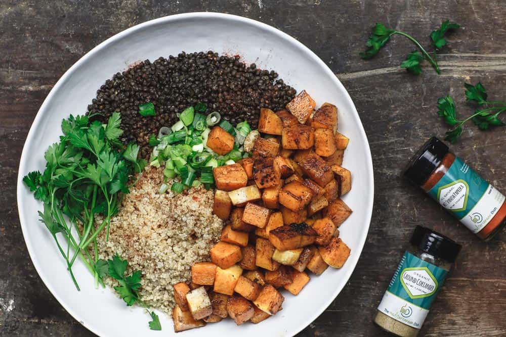 To assemble this easy roasted butternut squash recipe, combine butternut squash with lentils, quinoa, fresh parsley, green onions and spices