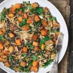 Easy Roasted Butternut Squash Recipe with Lentils and Quinoa. Seasoned with Mediterranean spices. Topped with toasted almond