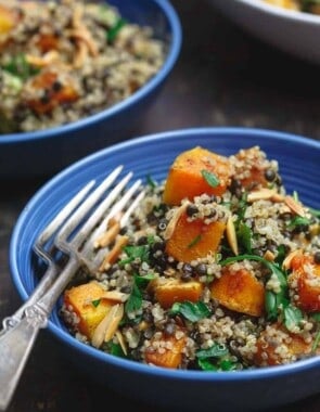 Close up side shot of Easy Roasted Butternut Squash with Lentils and Quinoa. Seasoned with Mediterranean spices and topped with toasted almonds