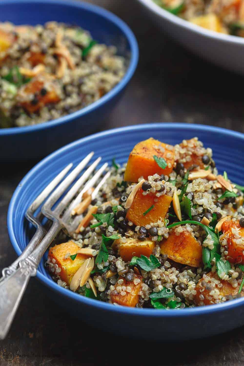 Close up side shot of Easy Roasted Butternut Squash with Lentils and Quinoa. Seasoned with Mediterranean spices and topped with toasted almonds