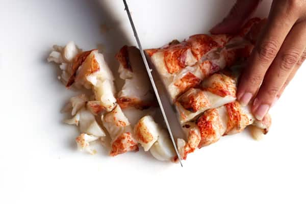 Cutting the lobster meat into pieces