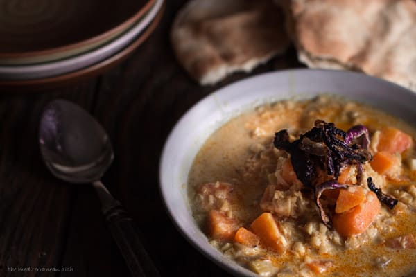 One serving of Curried Red Lentil and Sweet Potato Soup in a bowl