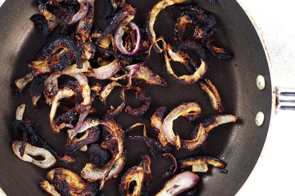 Onions being fried in pan 