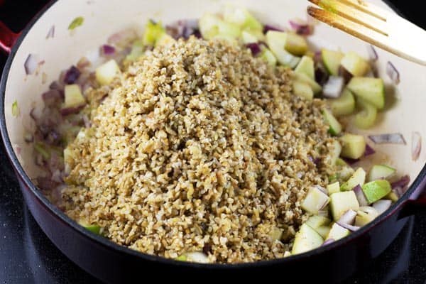 Add freekeh and spices to the cooking skillet 