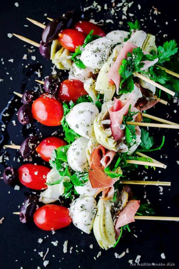 Antipasto skewers with prosciutto, mozzarella, artichokes | The Mediterranean Dish. An easy and impressive party appetizer that comes together in minutes! 