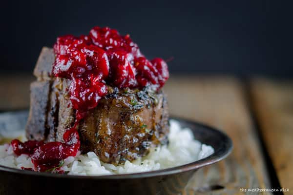 Cranberry-Harissa Chutney added to top of Lamb Chop 