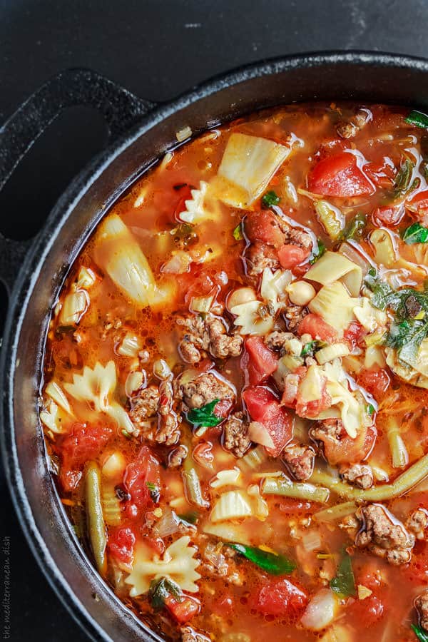 Soup ingredients all added to a pot to cook 