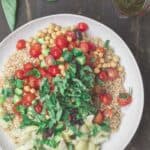 Mediterranean Couscous Recipe | The Mediterranean Dish. Think the best ever couscous salad! Toasted pearl couscous loaded with fresh chopped veggies and other Mediterranean favorites like chickpeas, olives and artichokes. A zesty lime vinaigrette brightens it even more! See the recipe on TheMediterraneanDish.com