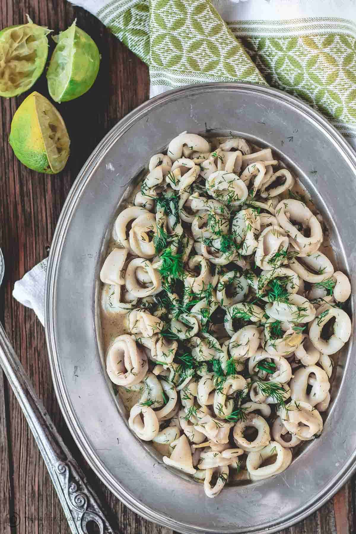 Calamari with garlic lime sauce served on platter as an appetizer