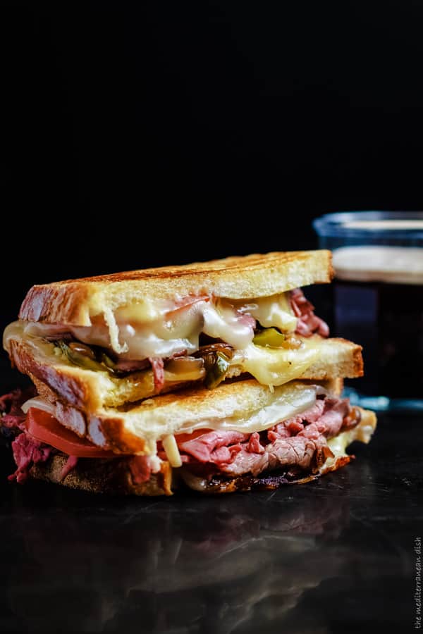 Grilled Roast Beef Sandwich served with a glass of Guinness Beer