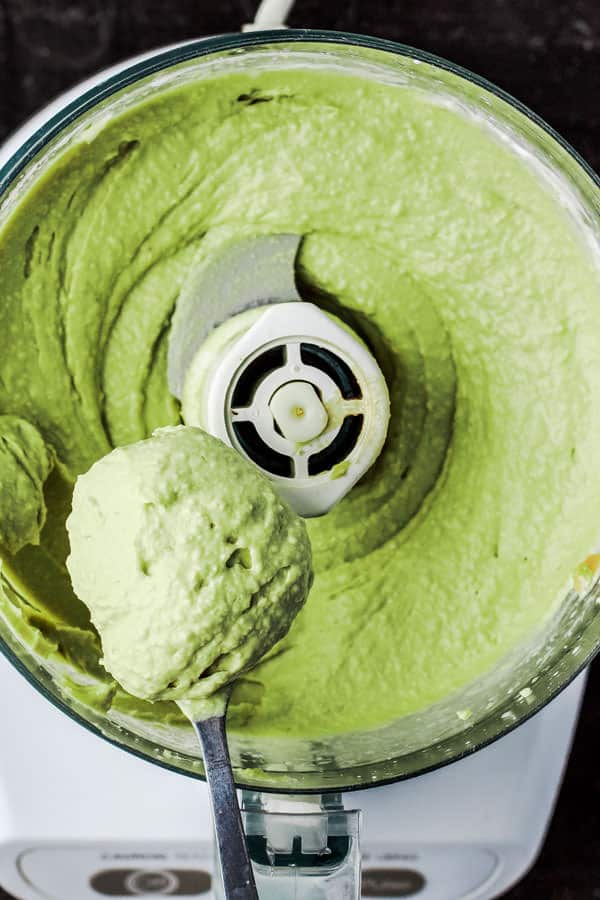 Avocado Hummus with Fresh Tomattillo Salsa Verde from The Mediterranean Dish! Super creamy avocado hummus topped with flavor packed fresh tomattillo salsa verde. Two amazing appetizer recipes combined! Step-by-step pictures included!