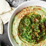 Avocado Hummus with Fresh Tomattillo Salsa Verde from The Mediterranean Dish! Super creamy avocado hummus topped with flavor packed fresh tomattillo salsa verde. Two amazing appetizer recipes combined! Step-by-step pictures included!