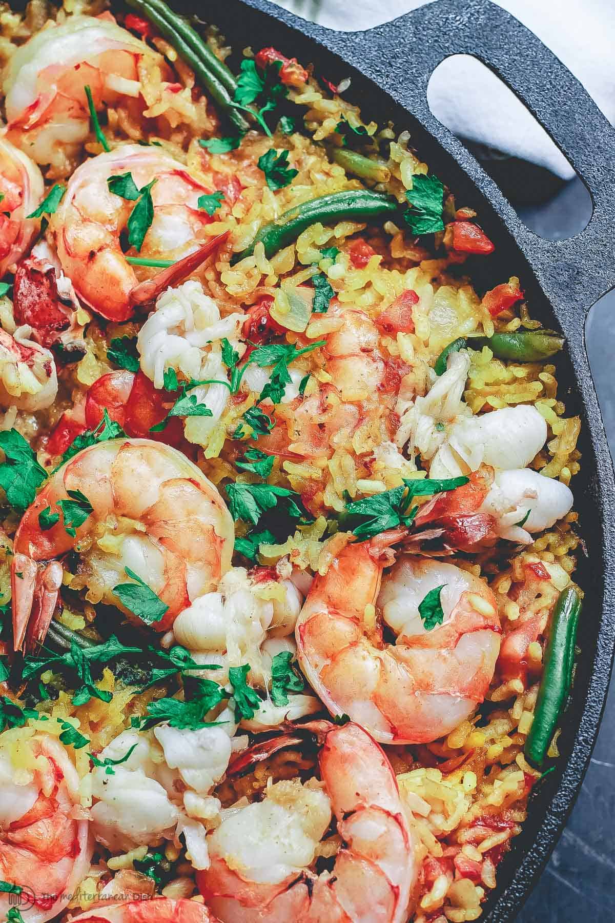 Seafood paella in a cast iron pan