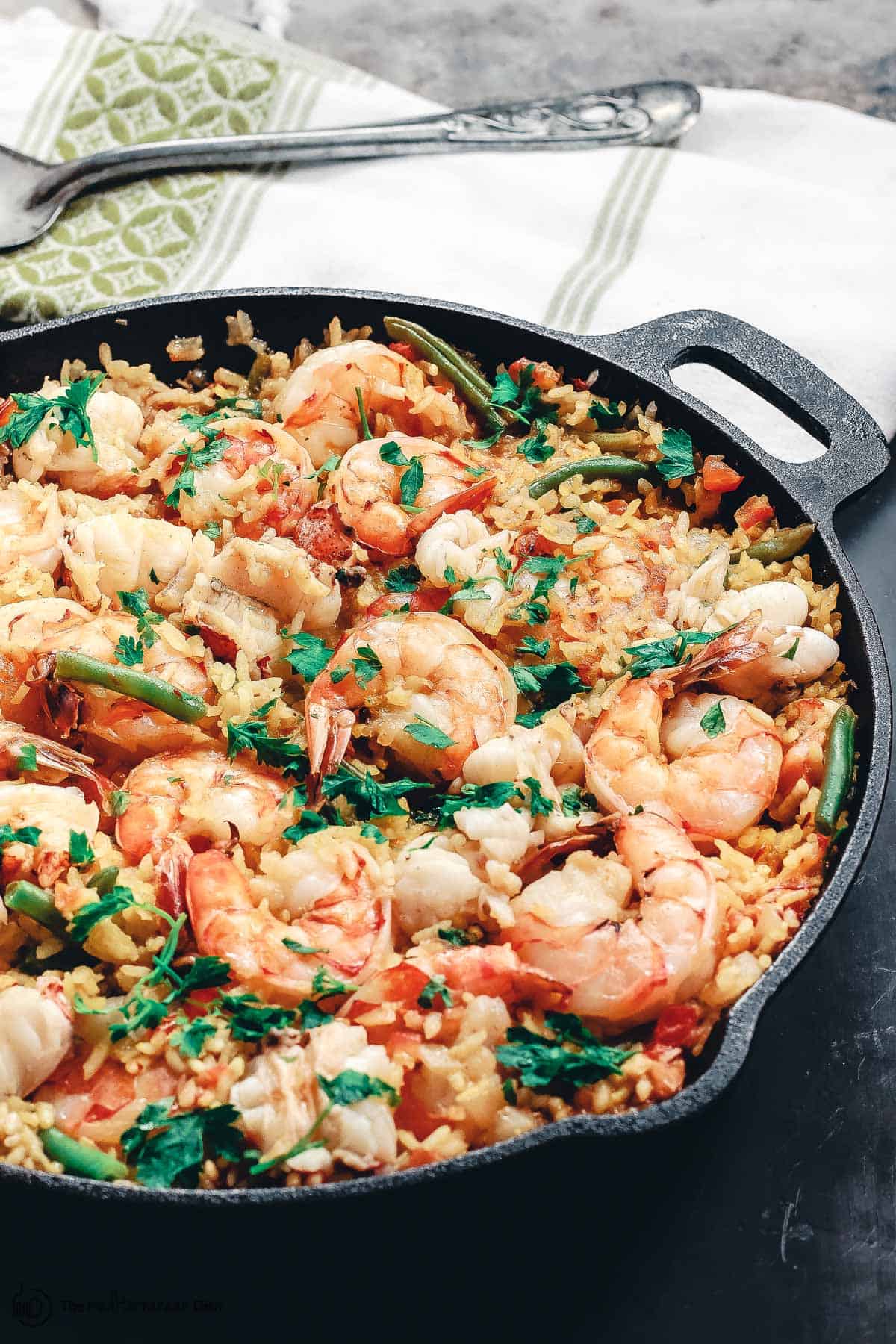 Seafood paella in a cast iron skillet