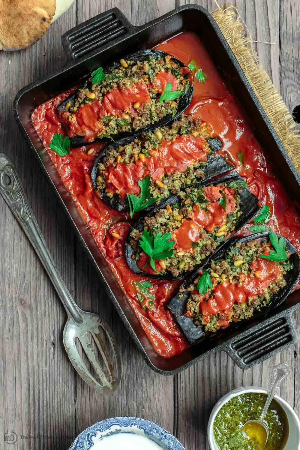 Mediterranean Stuffed Eggplant Recipe | The Mediterranean Dish. This is a must-try all star recipe for stuffed eggplants. Roasted eggplants stuffed with a fragrant spiced meat, bulgur and pine nut mixture. So good! See full recipe on TheMediterraneanDish.com