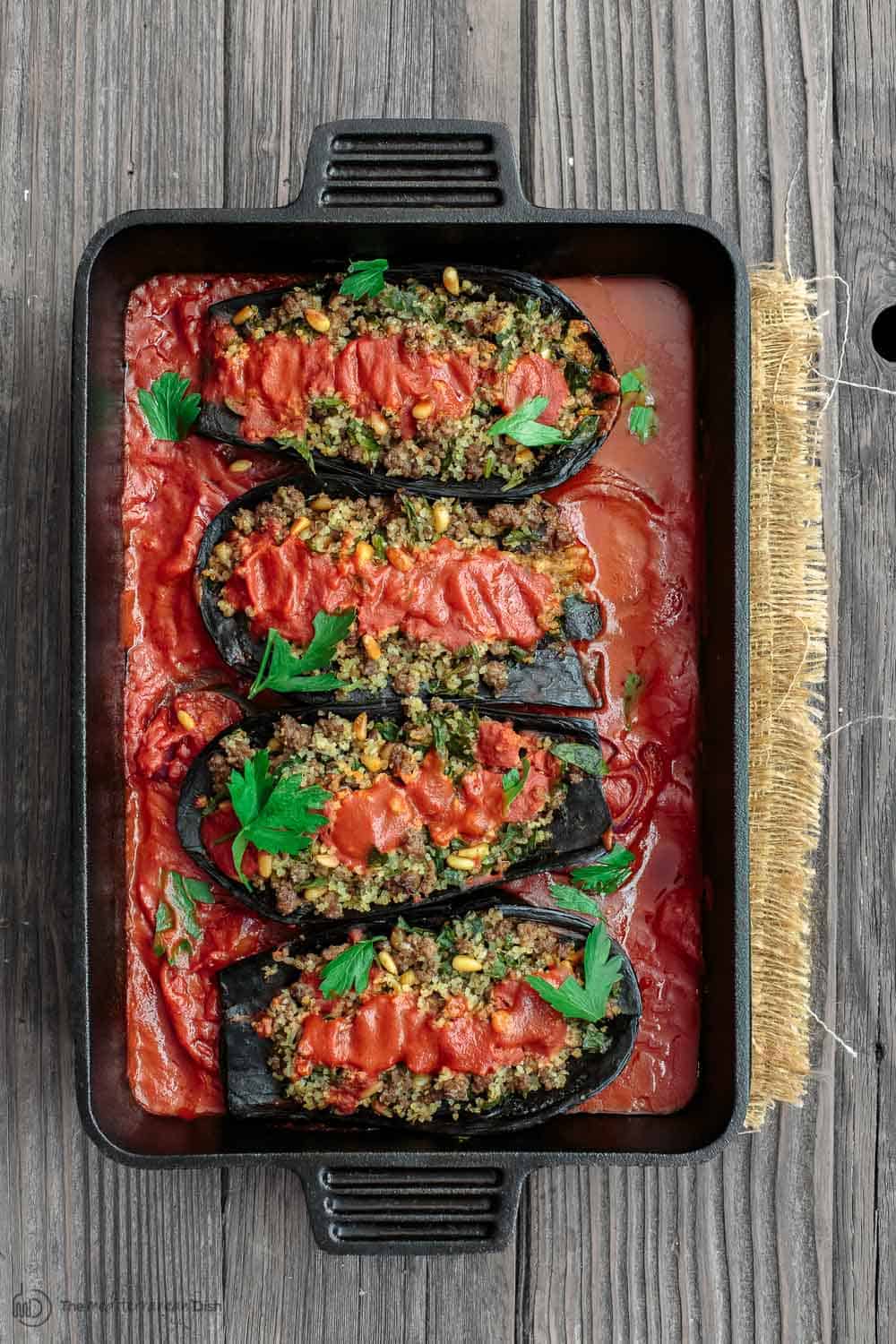 Mediterranean Stuffed Eggplant Recipe | The Mediterranean Dish. This is a must-try all star recipe for stuffed eggplants. Roasted eggplants stuffed with a fragrant spiced meat, bulgur and pine nut mixture. So good! See full recipe on TheMediterraneanDish.com