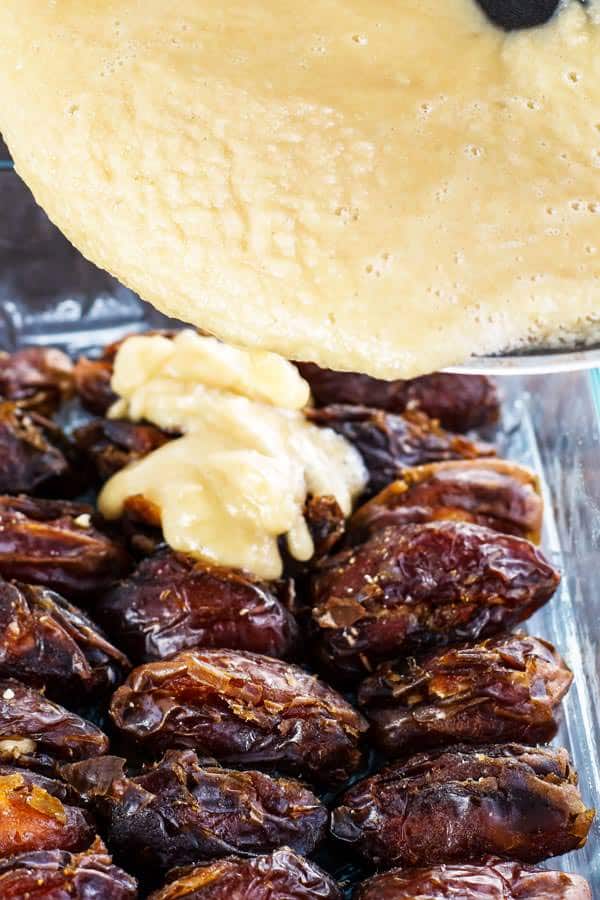 Flour and honey mixture is poured onto the dates