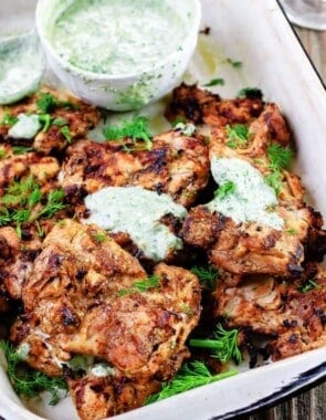 Mediterranean Grilled Chicken + Dill Greek Yogurt Sauce. Top grill recipe! Marinate boneless chicken thighs in Mediterranean spices, olive oil and lemon juice. Grill for less than 15 minutes, and serve with this flavor-packed dill yogurt sauce! Pin it to try soon!