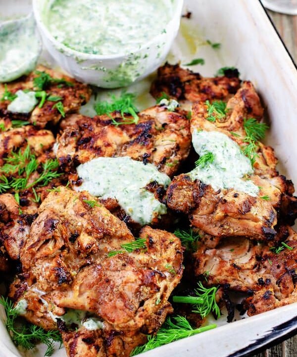 Mediterranean Grilled Chicken + Dill Greek Yogurt Sauce. Top grill recipe! Marinate boneless chicken thighs in Mediterranean spices, olive oil and lemon juice. Grill for less than 15 minutes, and serve with this flavor-packed dill yogurt sauce! Pin it to try soon!