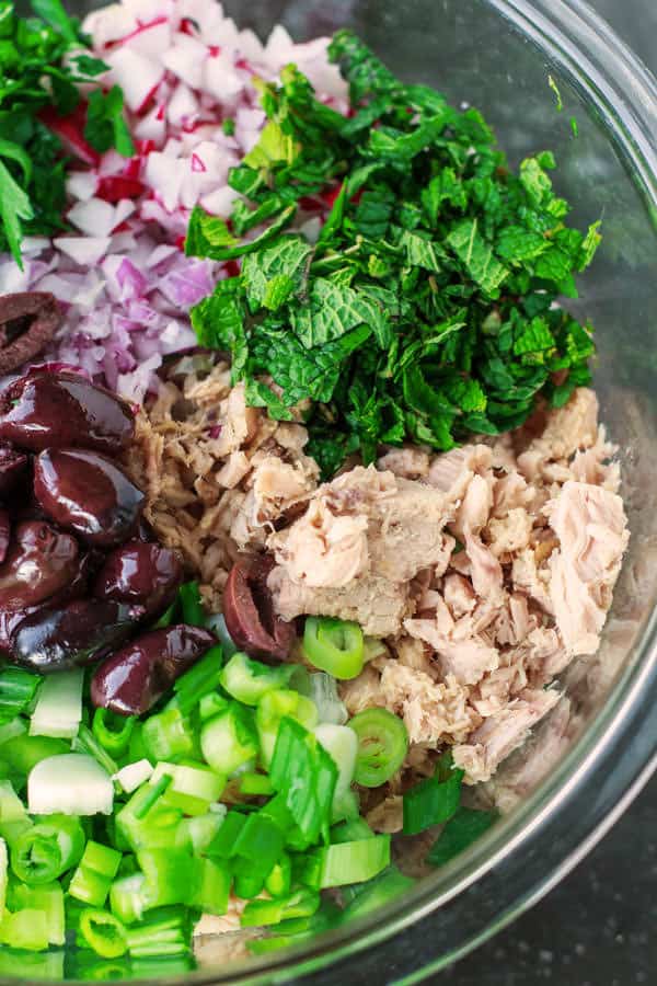 Mediterranean Tuna Salad with fresh herbs, chopped vegetables and a zesty Dijon vinaigrette! The best way to enjoy canned tuna!