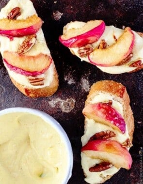 Roasted Peaches and Orange Whipped Greek yogurt crostini | The Mediterranean Dish. An easy recipe that will satisfy the sweet tooth in all of us. Serve these crostini for brunch or dessert!