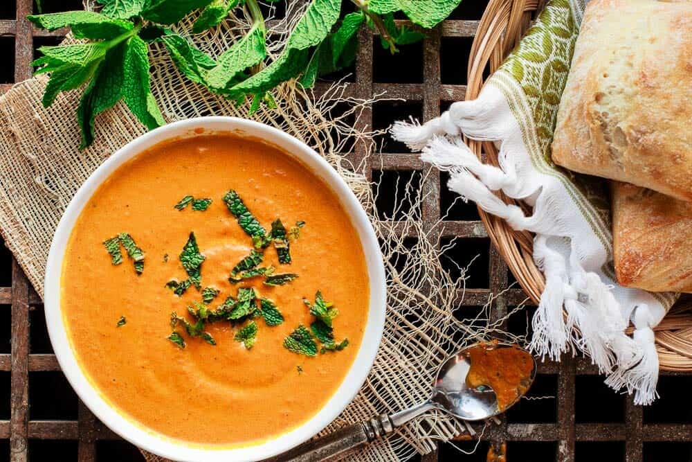 Roasted Carrot Soup with a garnish of fresh mint