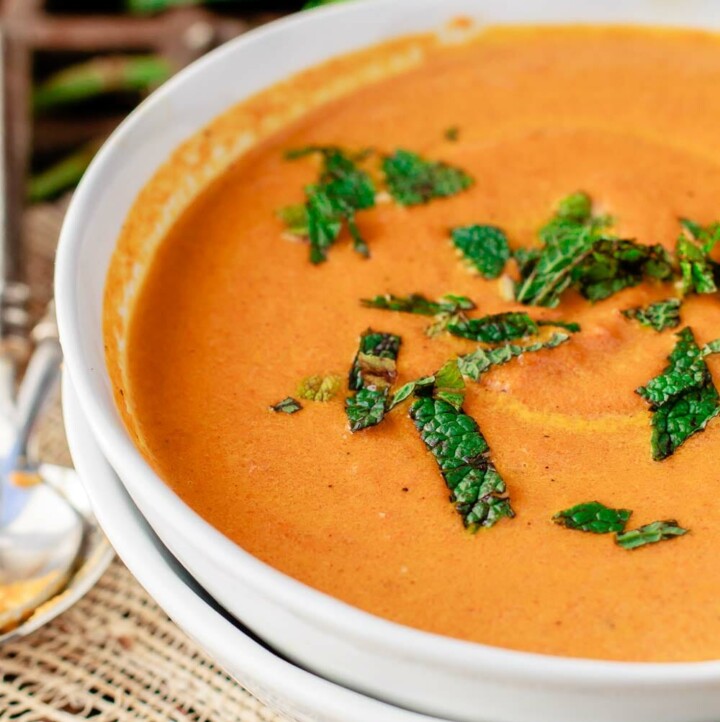 Roasted Carrot Soup with Ginger, Mediterranean spices, and fresh mint garnish.