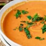 BEST Roasted Carrot Soup | The Mediterranean Dish. This roasted carrot soup is creamy but still light and packed with flavor from warm Mediterranean spices, garlic, and fresh ginger. Gluten Free. Leftovers are even better the next day. Recipe and video on TheMediterraneanDish.com #carrotsoup #roastedcarrot #vegetariansoup #soup #glutenfree #mealprep #mediterraneanrecipe