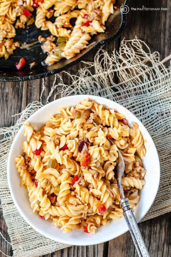 One-Skillet Macaroni and Cheese with Italian Sausage and Bell Peppers | The Mediterranean Dish. Try this delicious Italian twist on macaroni and cheese! The perfect comfort skillet meal; comes together in minutes!