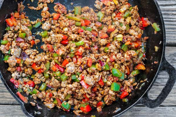 One-Skillet Macaroni and Cheese with Italian Sausage and Bell Peppers | The Mediterranean Dish. Try this delicious Italian twist on macaroni and cheese! The perfect comfort skillet meal; comes together in minutes! 