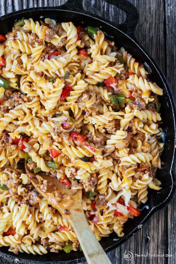 One-Skillet Macaroni and Cheese with Italian Sausage and Bell Peppers | The Mediterranean Dish. Try this delicious Italian twist on macaroni and cheese! The perfect comfort skillet meal; comes together in minutes! 